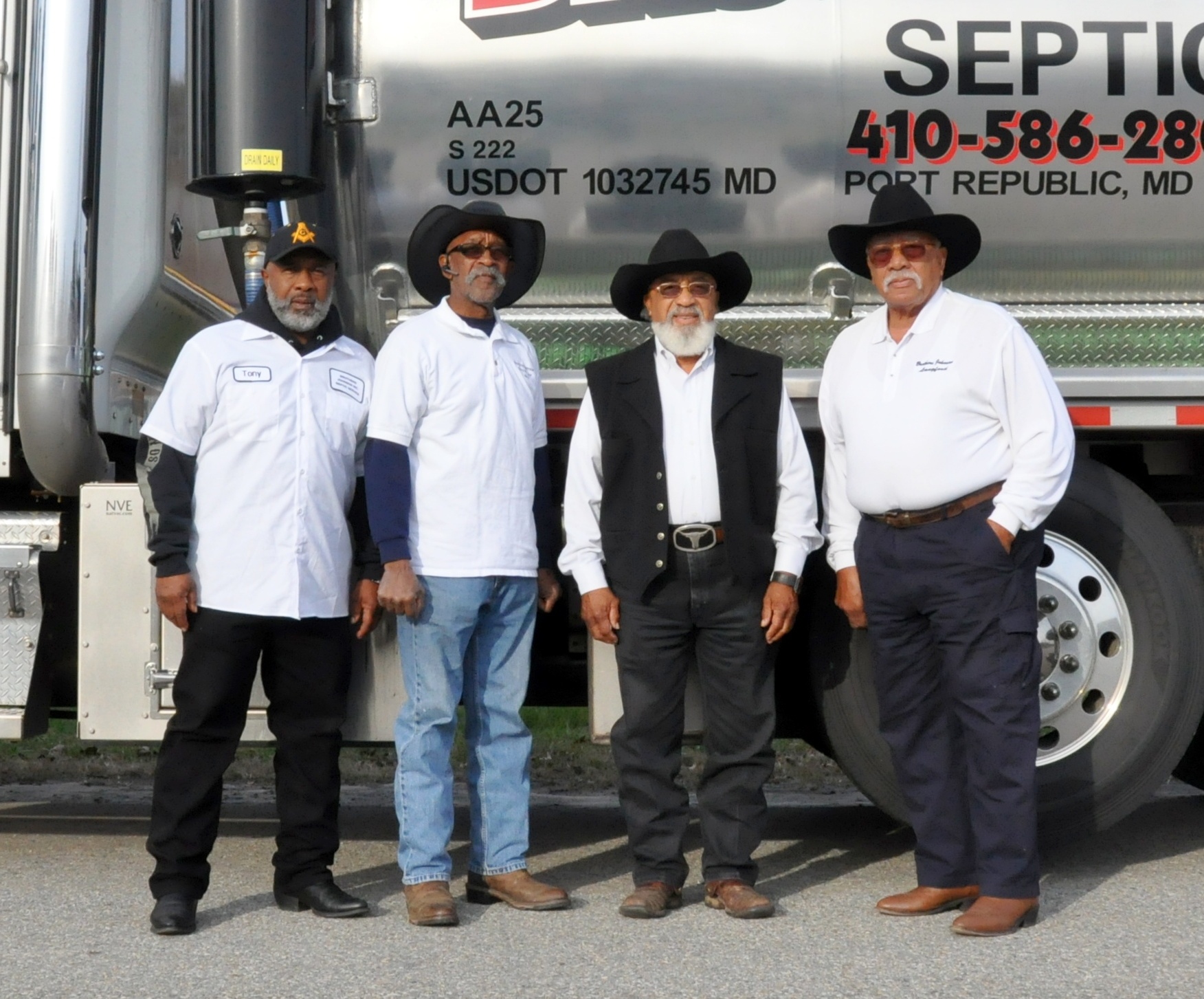 The Johnson family with the Brother's Johnson septic tanker truck